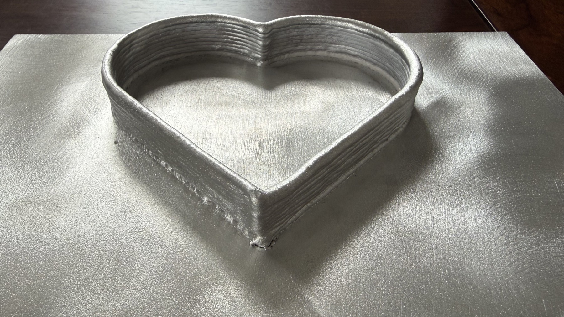 Heart-shaped robotic laser wire deposition training sample
