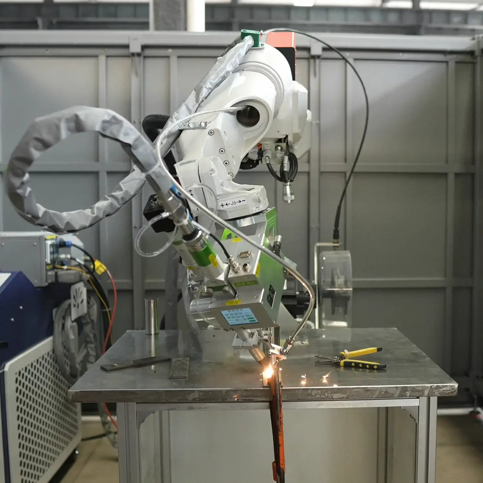 Robotic laser welding system with welding head working on a fixture table