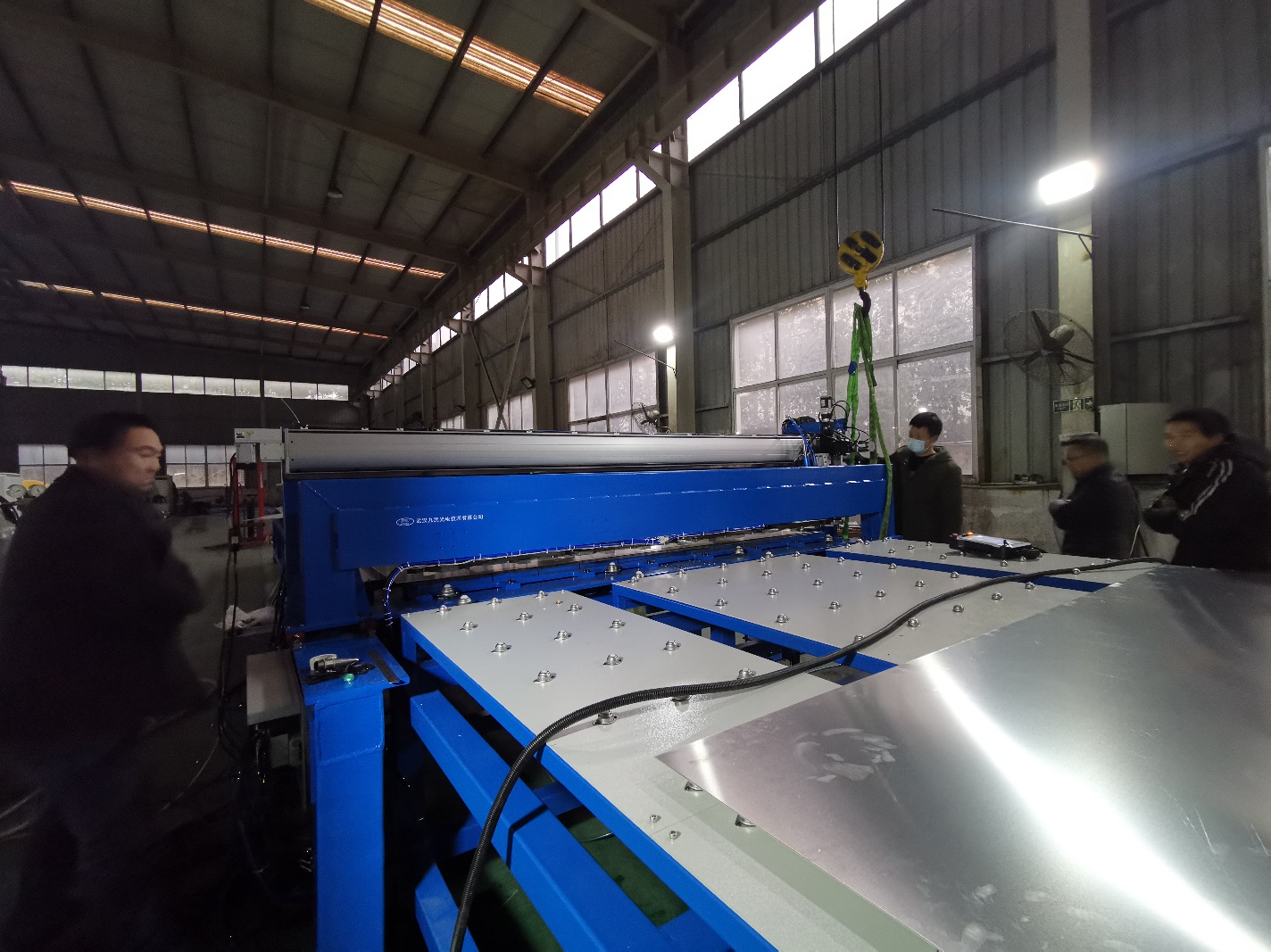 Robot laser welding a thin sheet transport panel